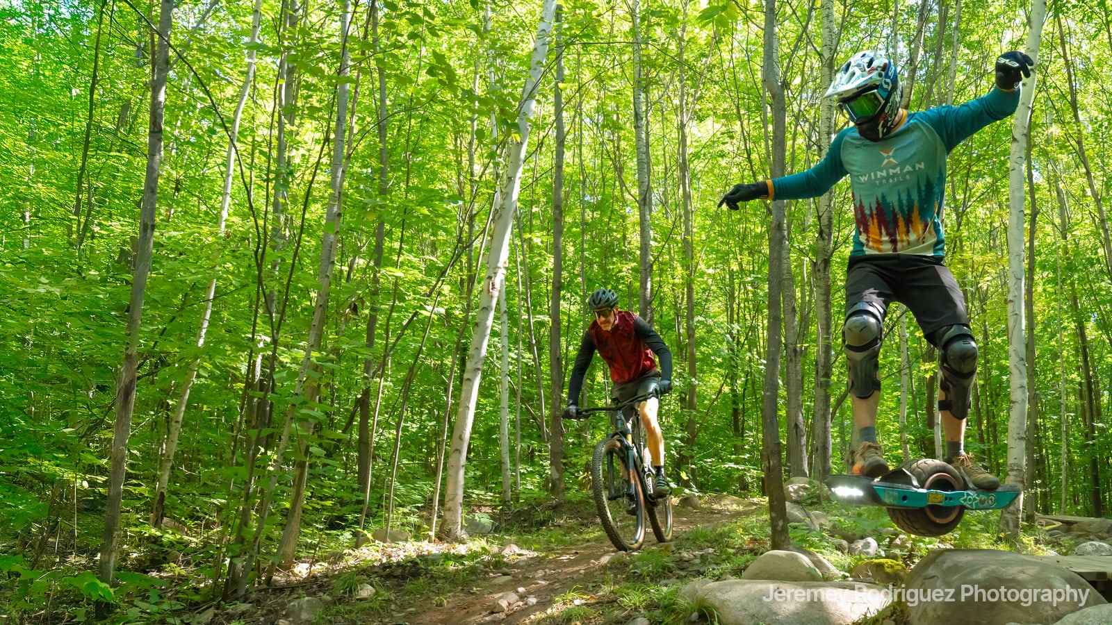 Onewheel Rider Balancing in a Green Forest