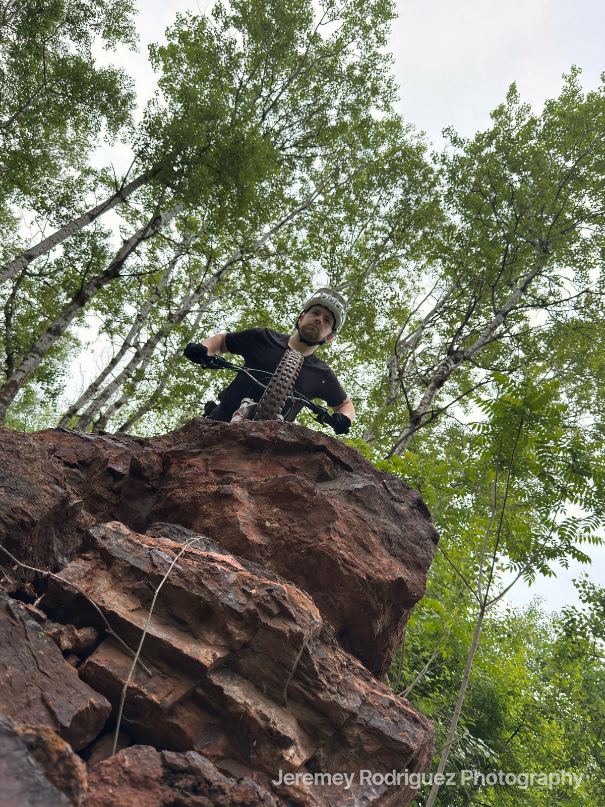 Rider Dropping Off a Rocky Ledge