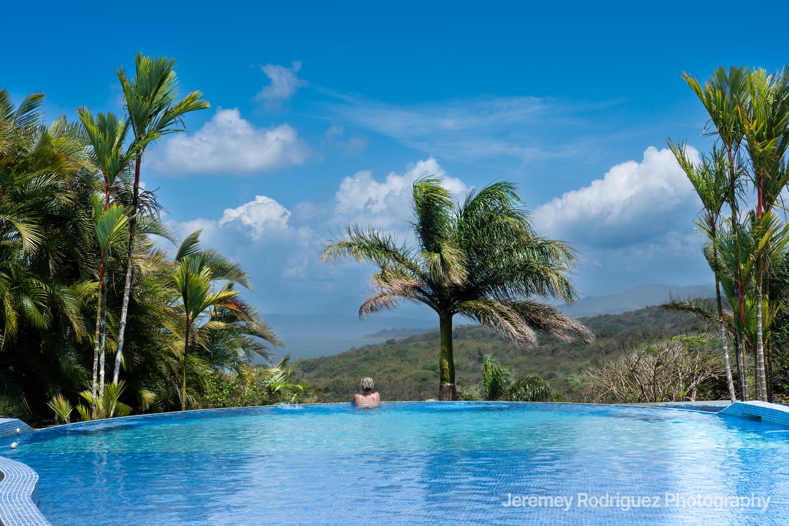 Infinity Pool Overlooking Tropical Hills