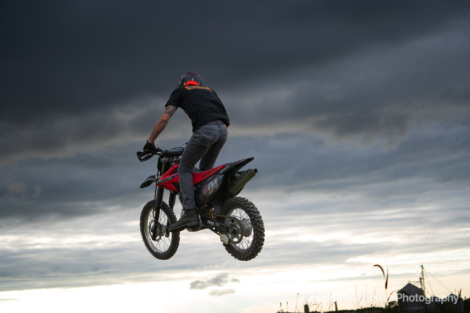 Silhouetted Dirt Bike Jump at Dusk