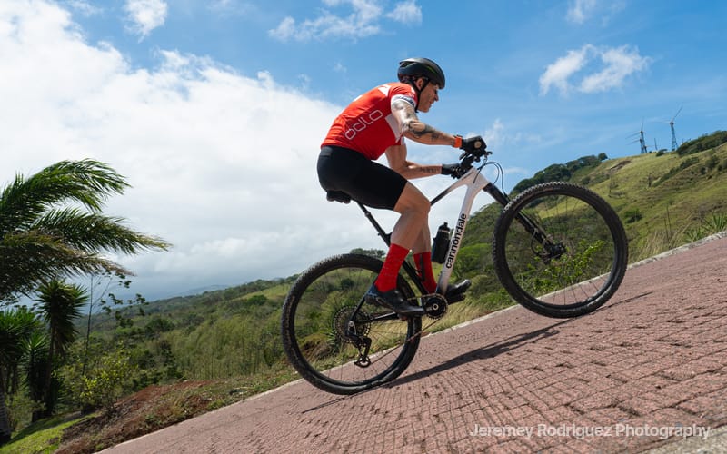 Rider Powering Up a Steep Brick Climb