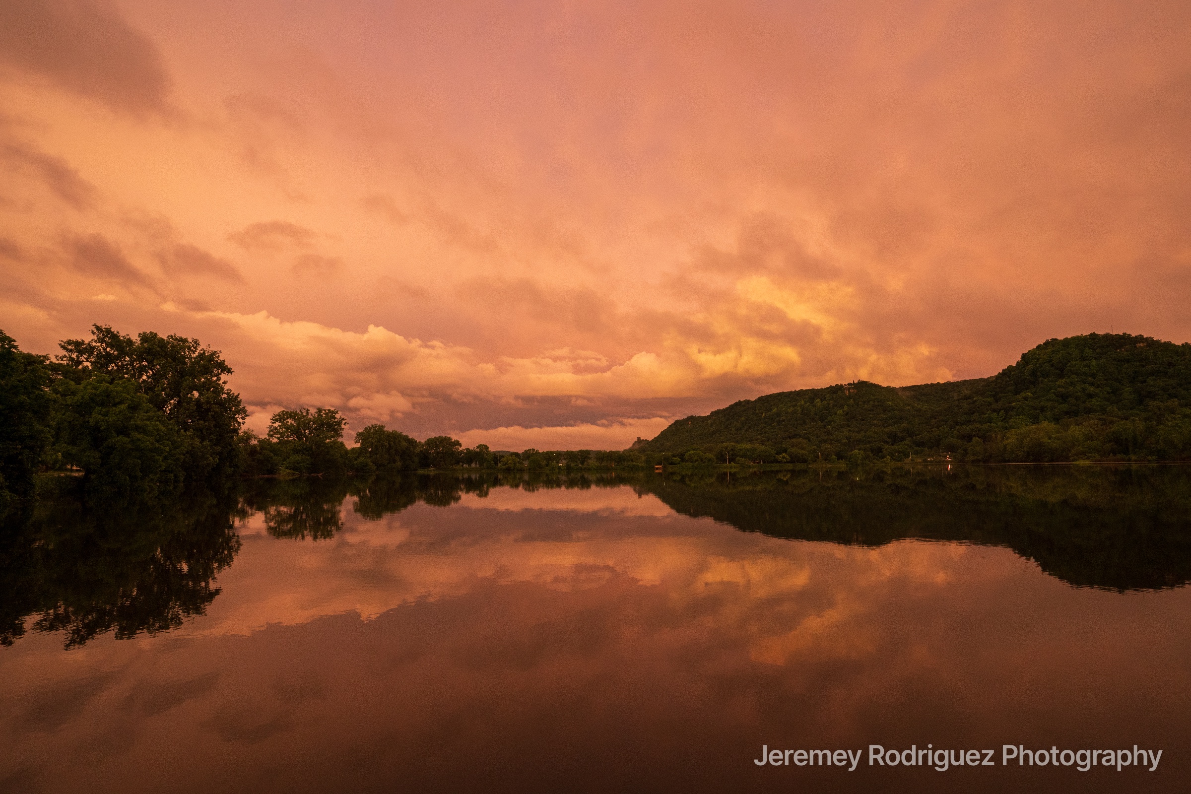 Glowing Peach Sky Reflected Lake in Winona, Minnesota