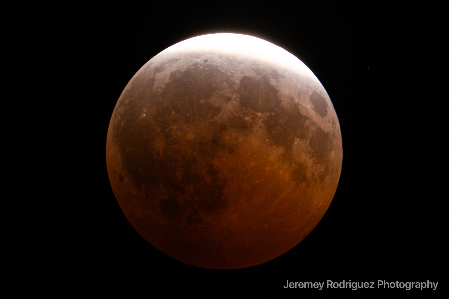 Partial Lunar Eclipse With Glowing Red Moon