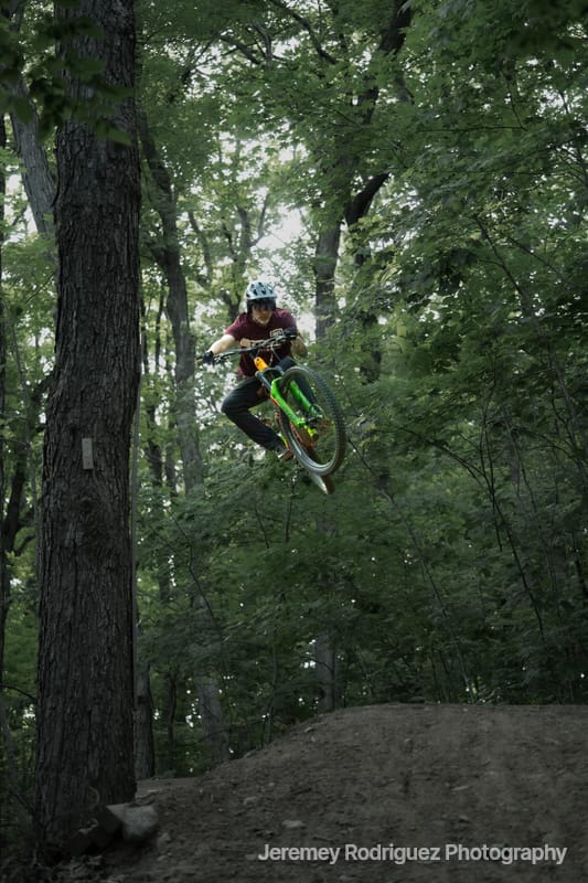 Rider Catching Air Off a Dirt Jump