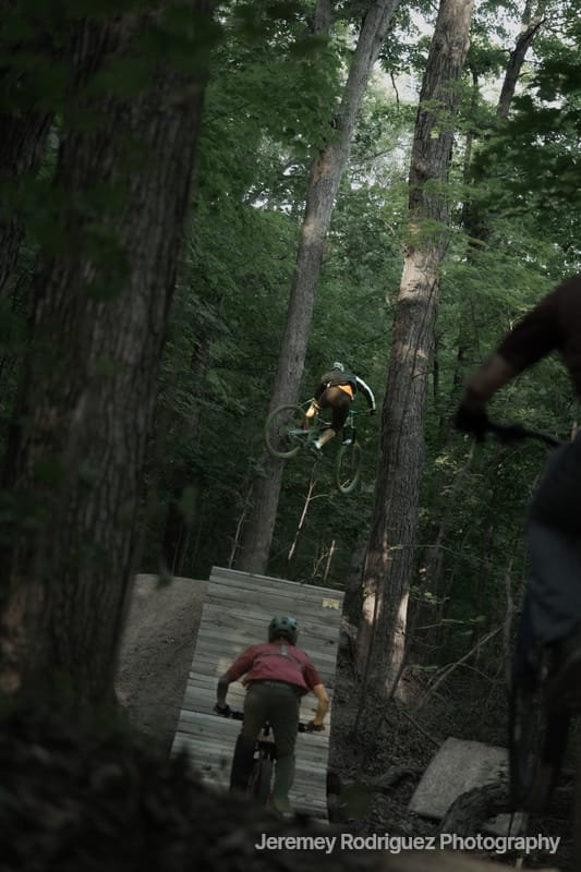 Riders Dropping a Wooden Forest Feature