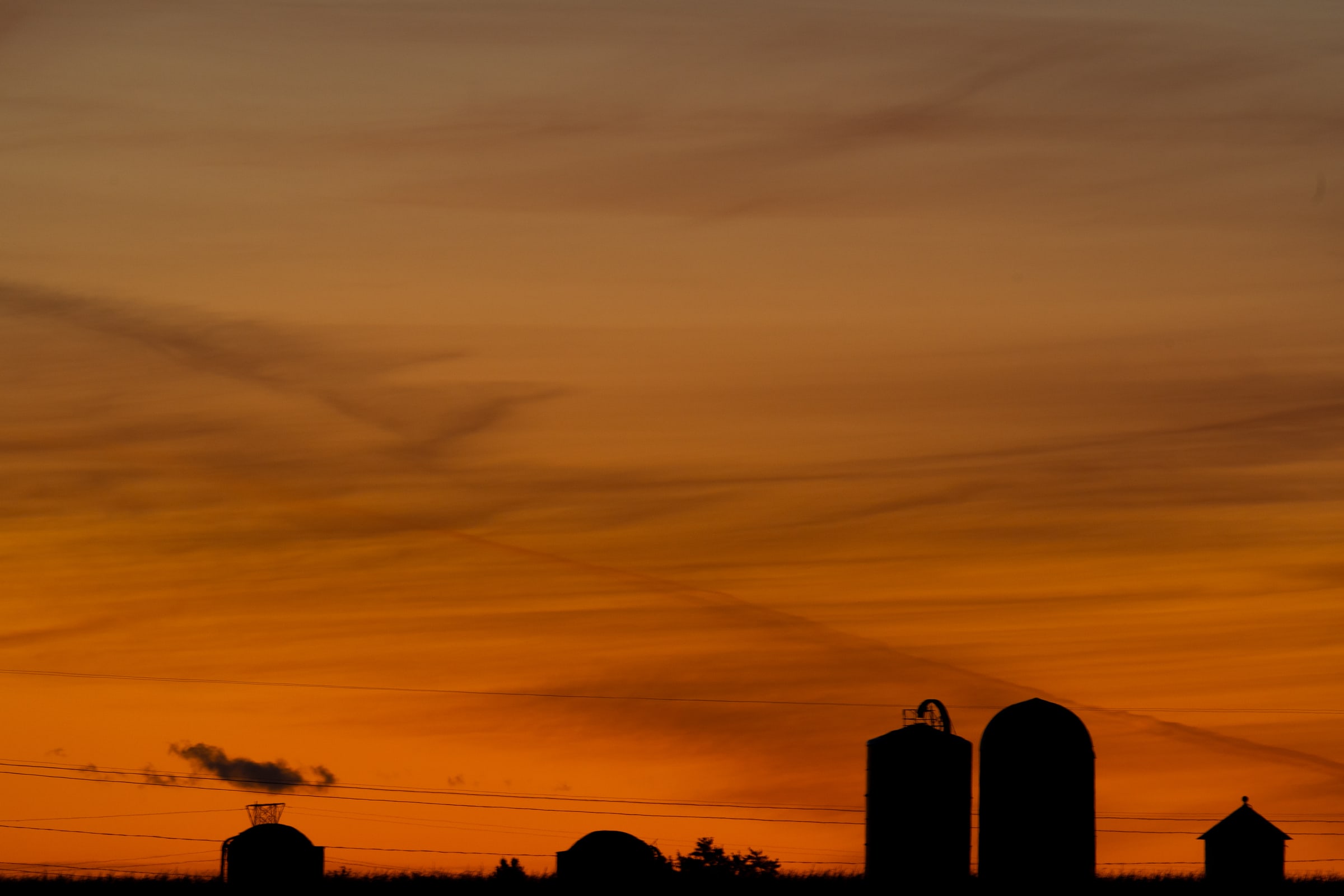 Wisconsin Golden Sunset Over Farm Grain Bins