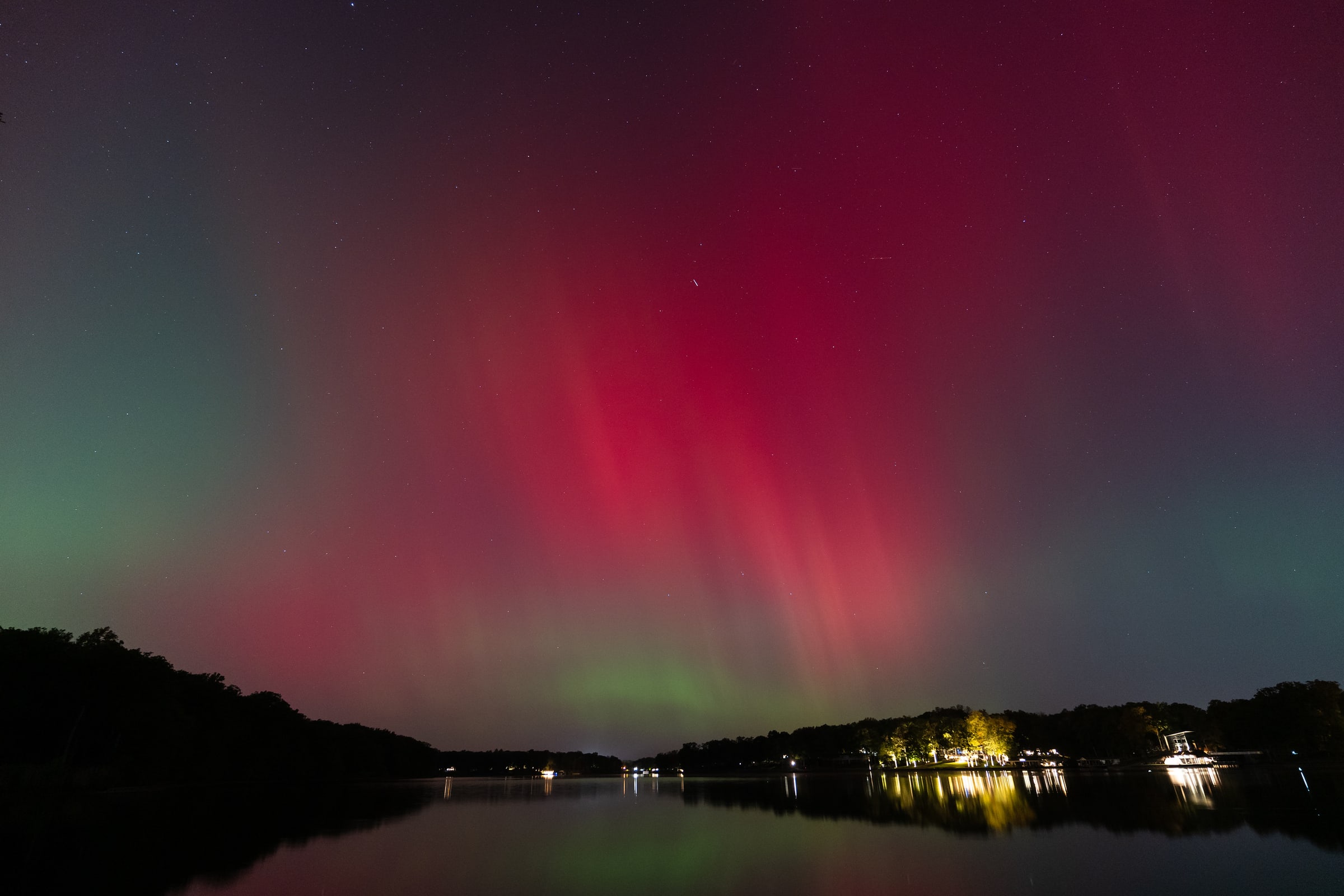 Aurora Pillars Above a Reflective Lake