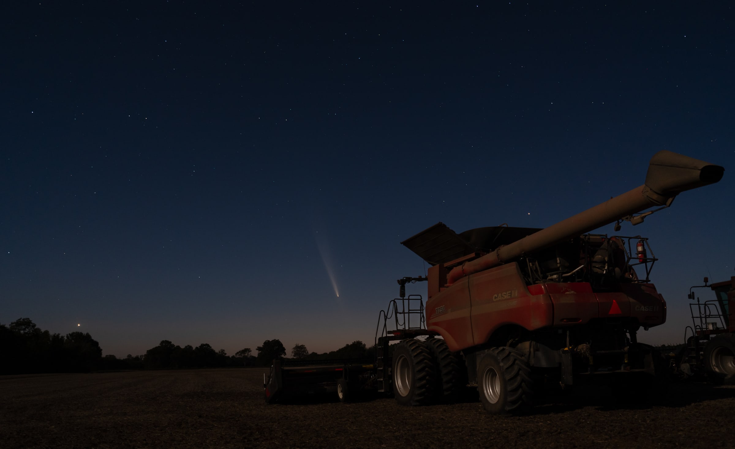Comet Tsuchinshan-Atlas Over a Combine