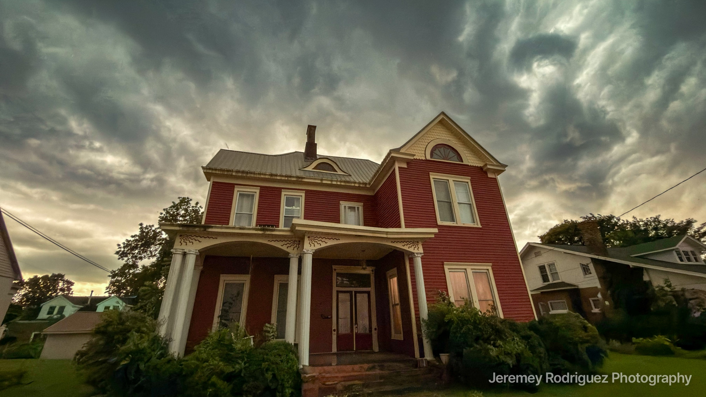 Marion Kentucky Red Victorian House Under Dramatic Storm Clouds