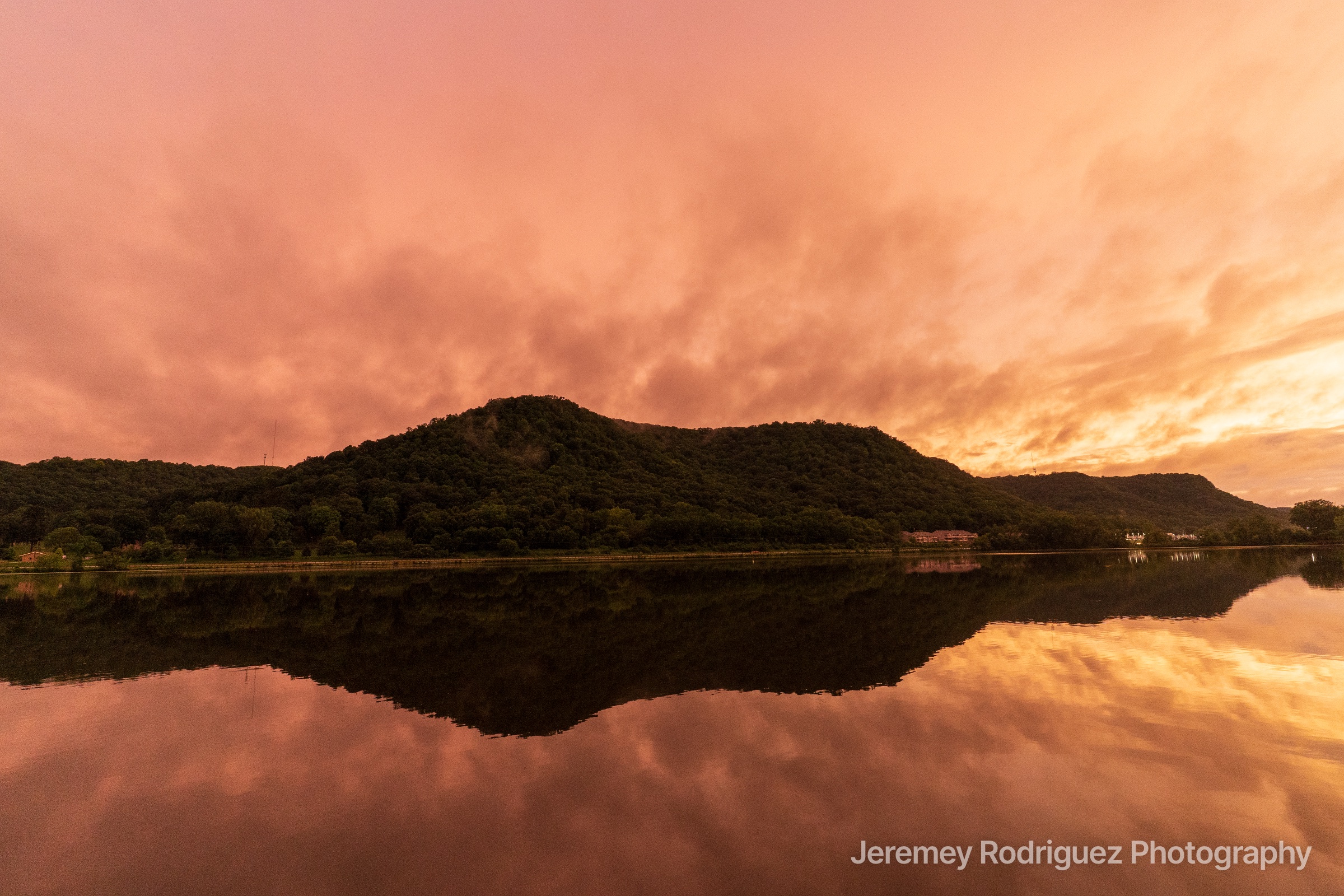 Winona Wooded Bluff Mirrored in Still Water at Dusk