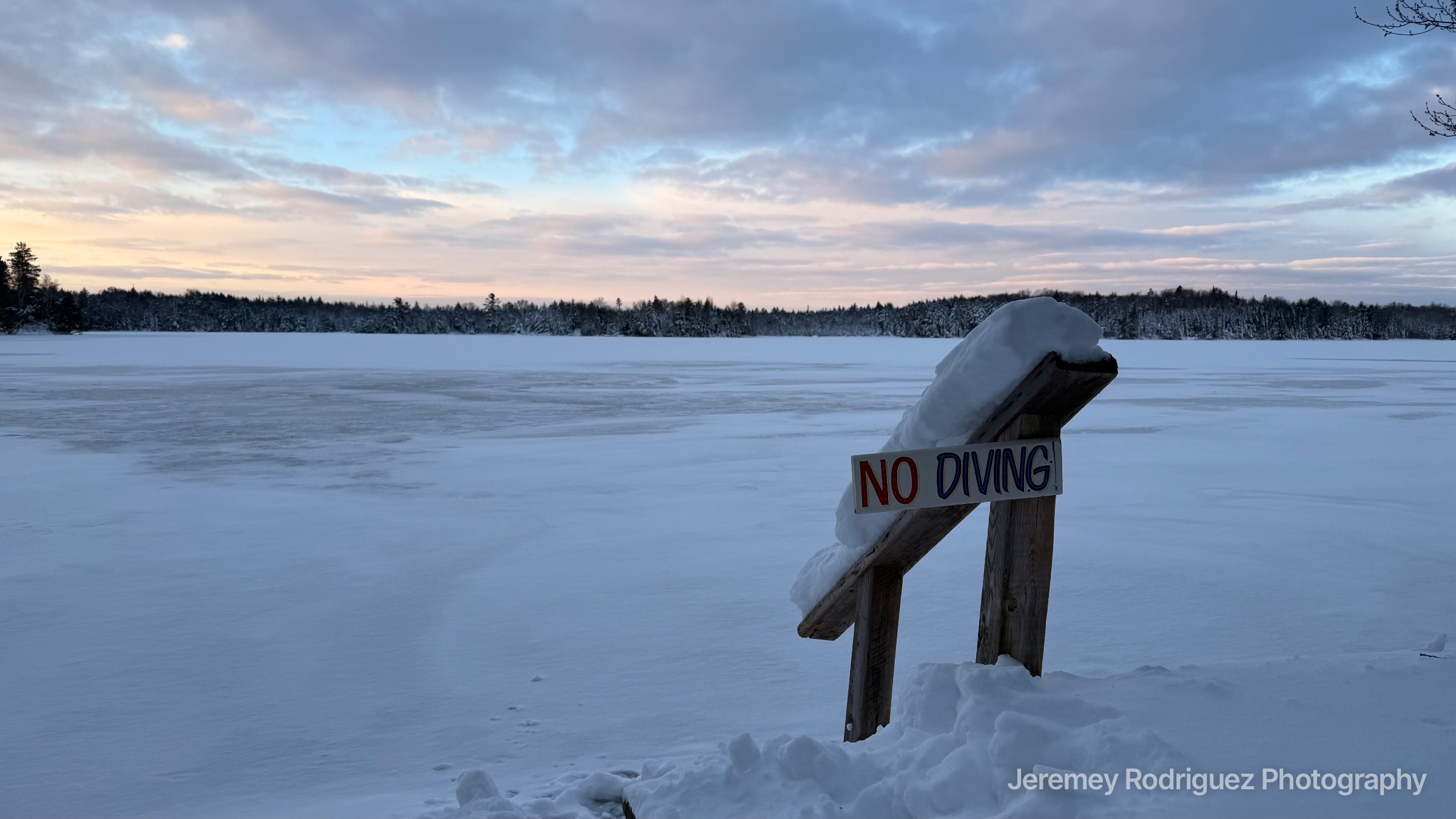 Northwoods Snow-Capped No Diving Sign on a Frozen Lake in Wisconsin