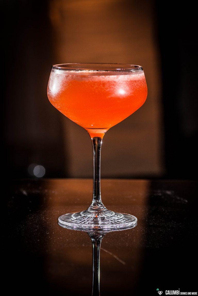 Naked & Famous cocktail in a coupe glass