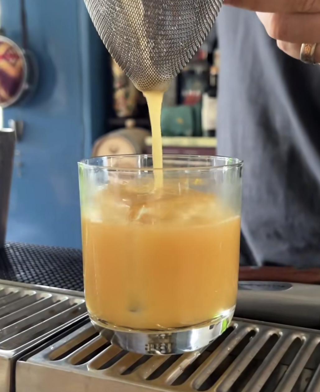 The Last Buzz cocktail in a lowball glass with clear ice and salt garnish