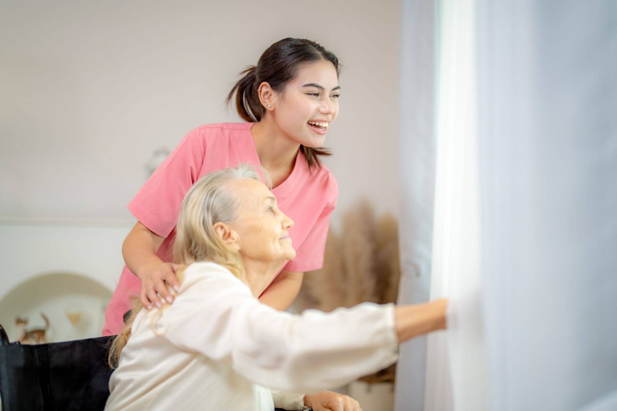 Caregiver supporting a senior at home, a core skill taught in an elderly caregiver course