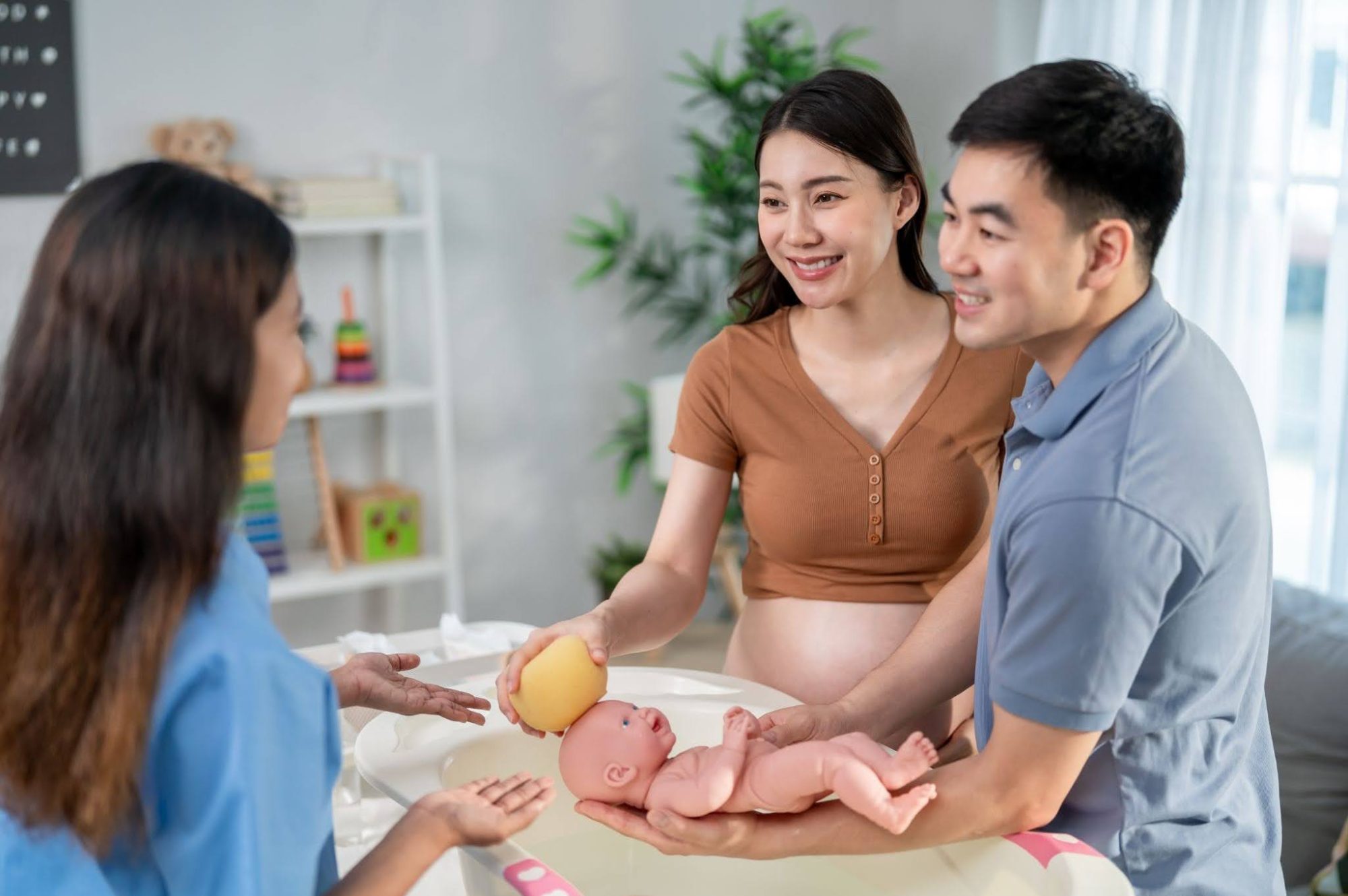 New parents learning infant care with their newborn baby