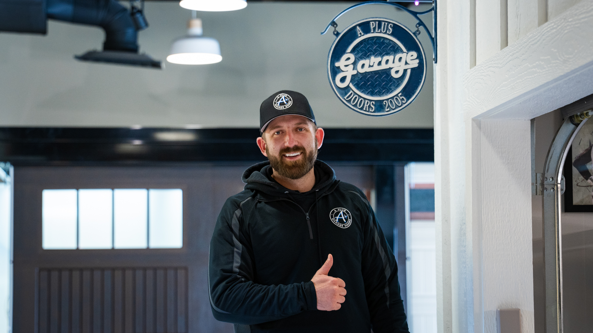 A Plus Garage Door Repair technician giving thumbs up