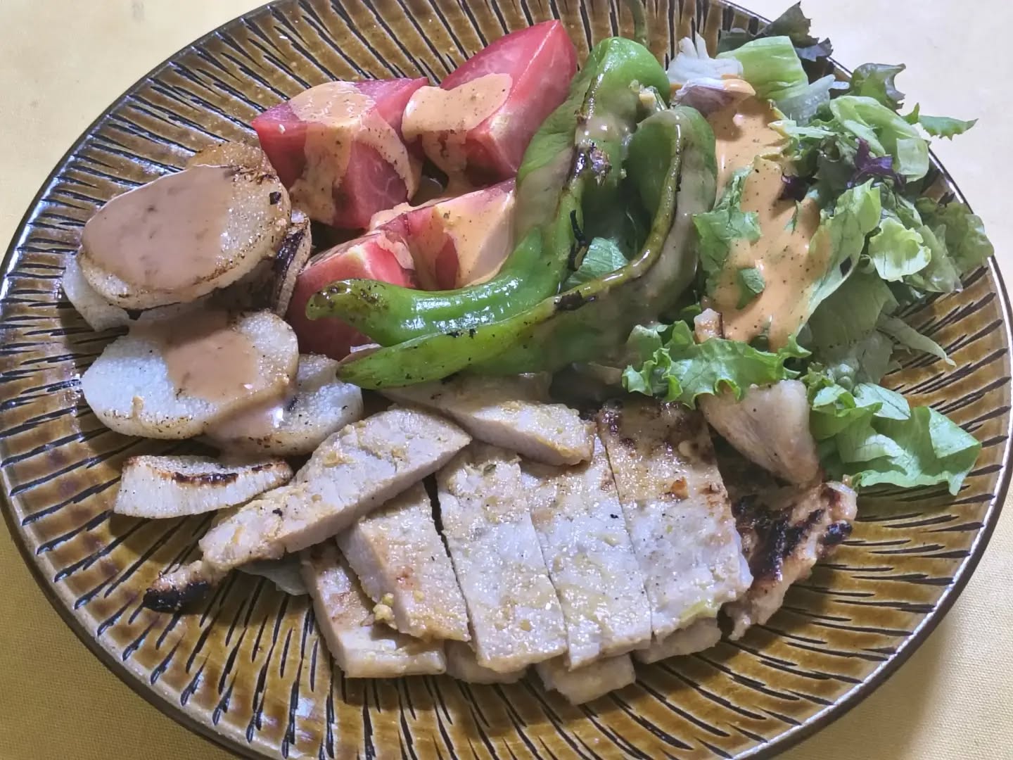Dinner with grilled miso pork and pantry side dishes. Laid out, there's a quiet, wholesome depth to it.