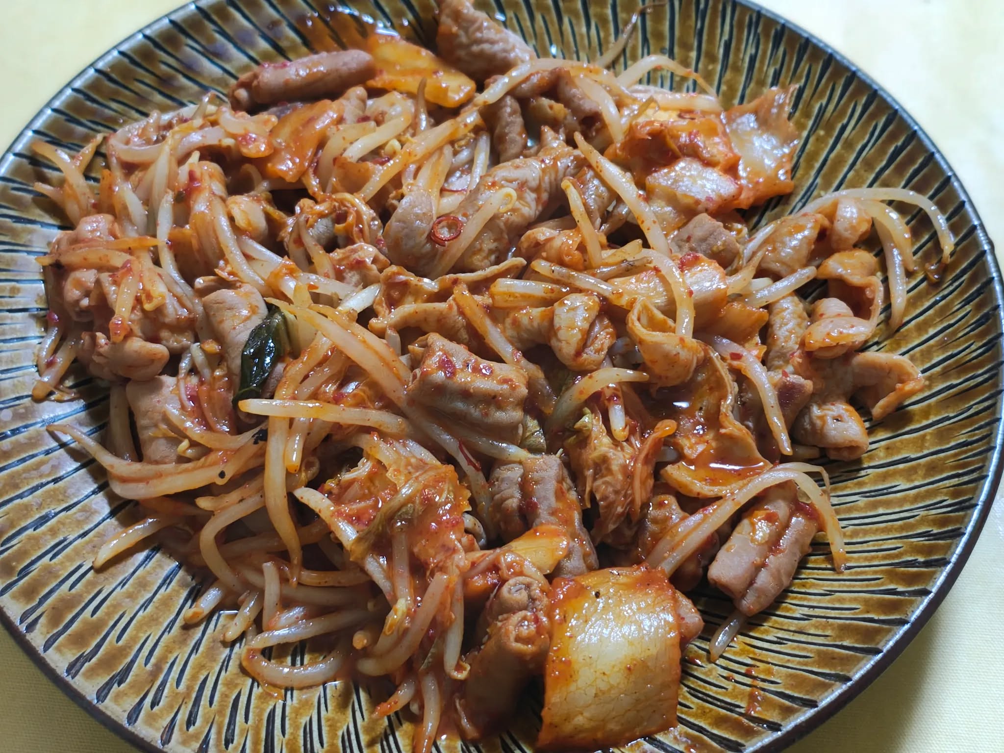 Stamina stir-fry with pork offal, kimchi, and crisp bean sprouts.