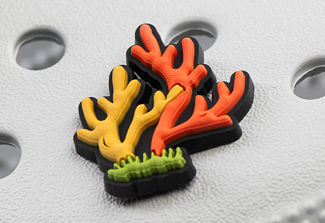 Crocs charm - virus - Seaweed orange
