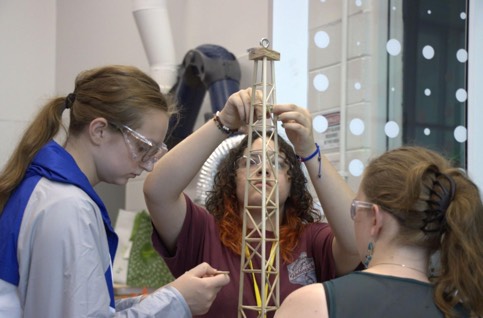 Three teenage girls doing an engineering project