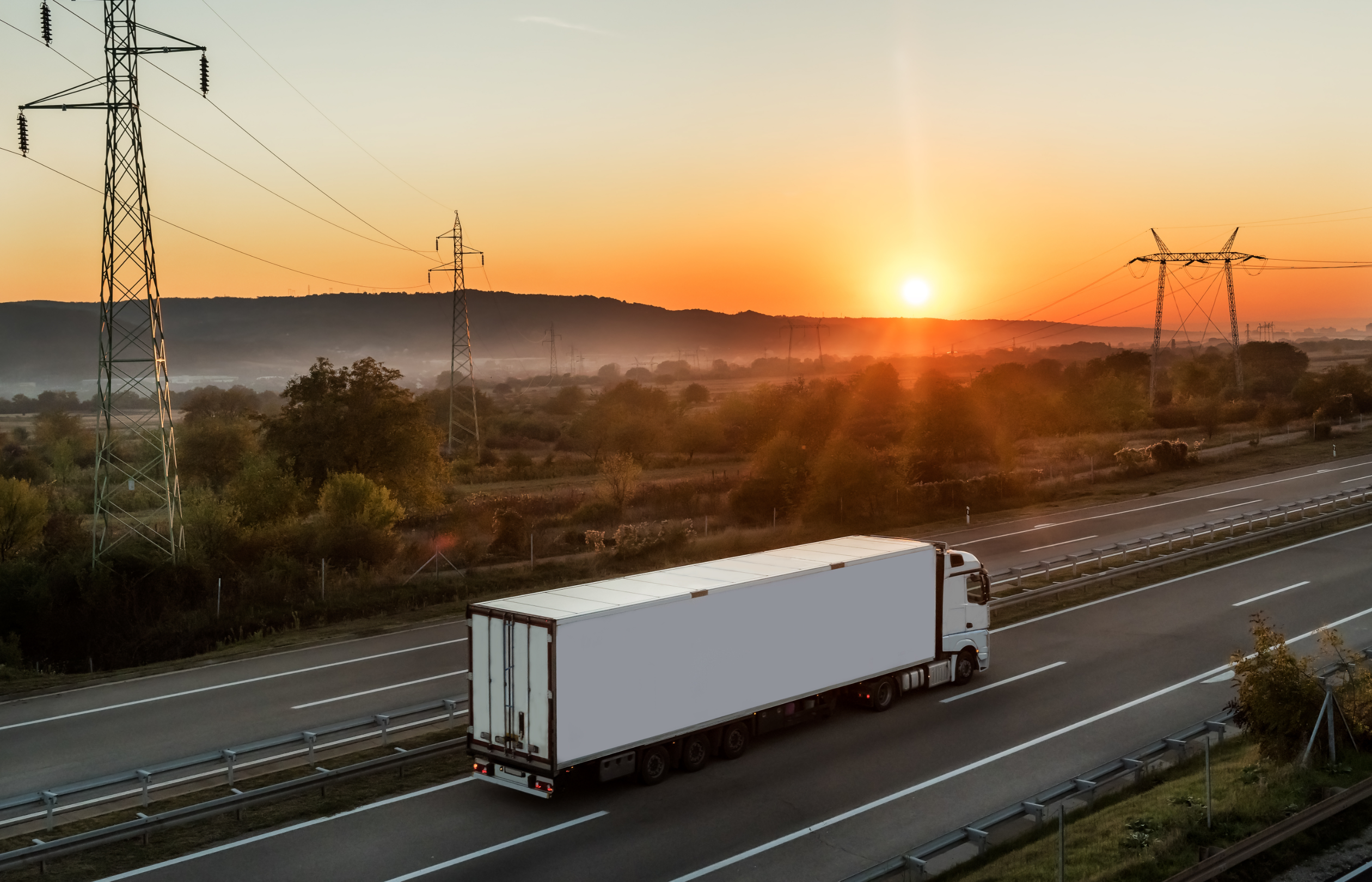 A haulage truck driving into the sunset, reflecting the industry's journey
towards embracing advanced technology, sustainability, and improved efficiency to
overcome outdated mindsets.