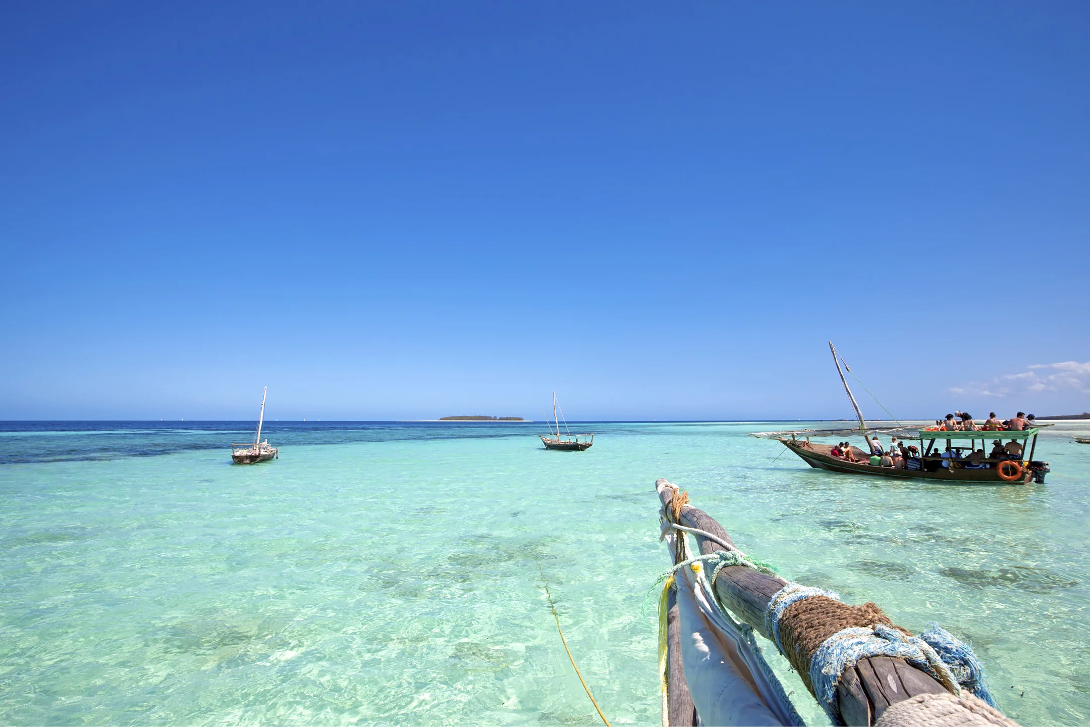 Traditional dhow boats in clear Zanzibar water