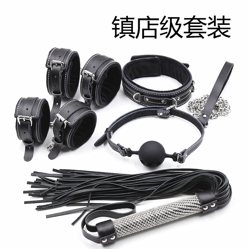 Black cowhide leather bondage set with wrist and ankle cuffs, collar and leash, ball gag and flogger