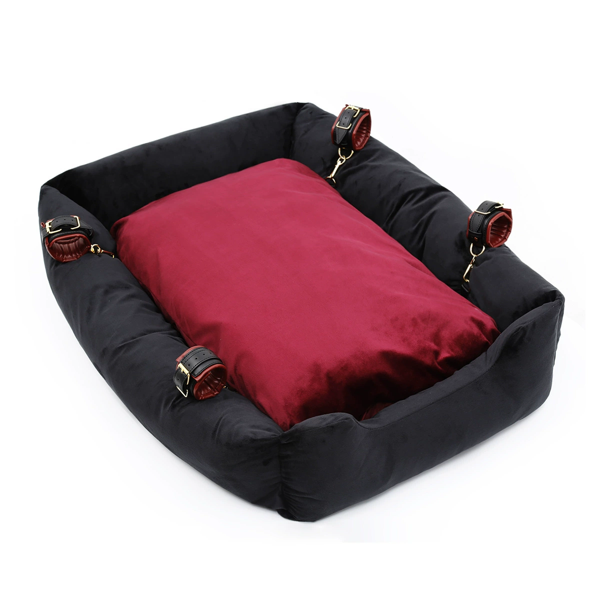 Black velvet pet bed with a burgundy cushion and four black and burgundy cuffs clipped to its sides
