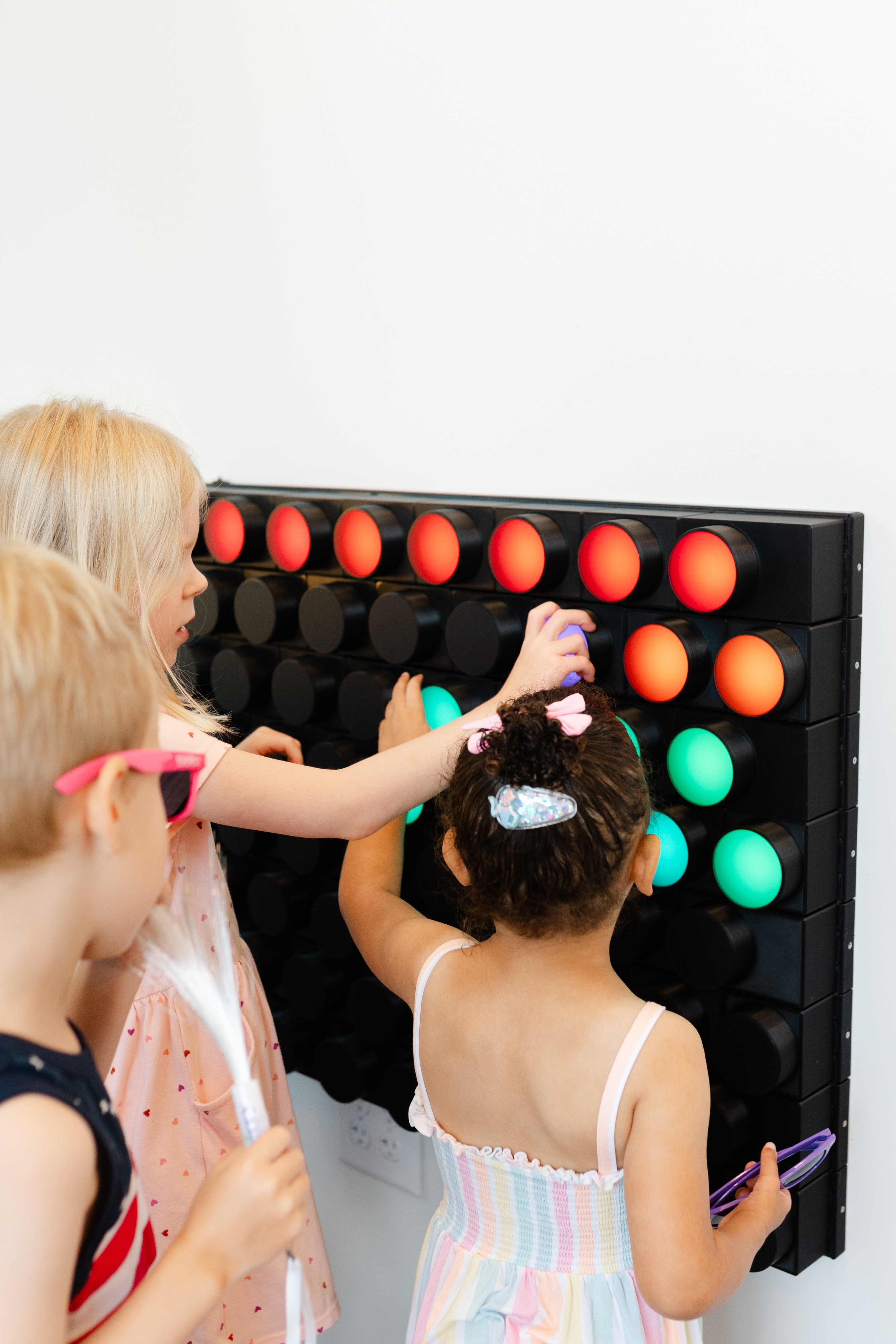 Children playing with a Knobbles interactive light wall