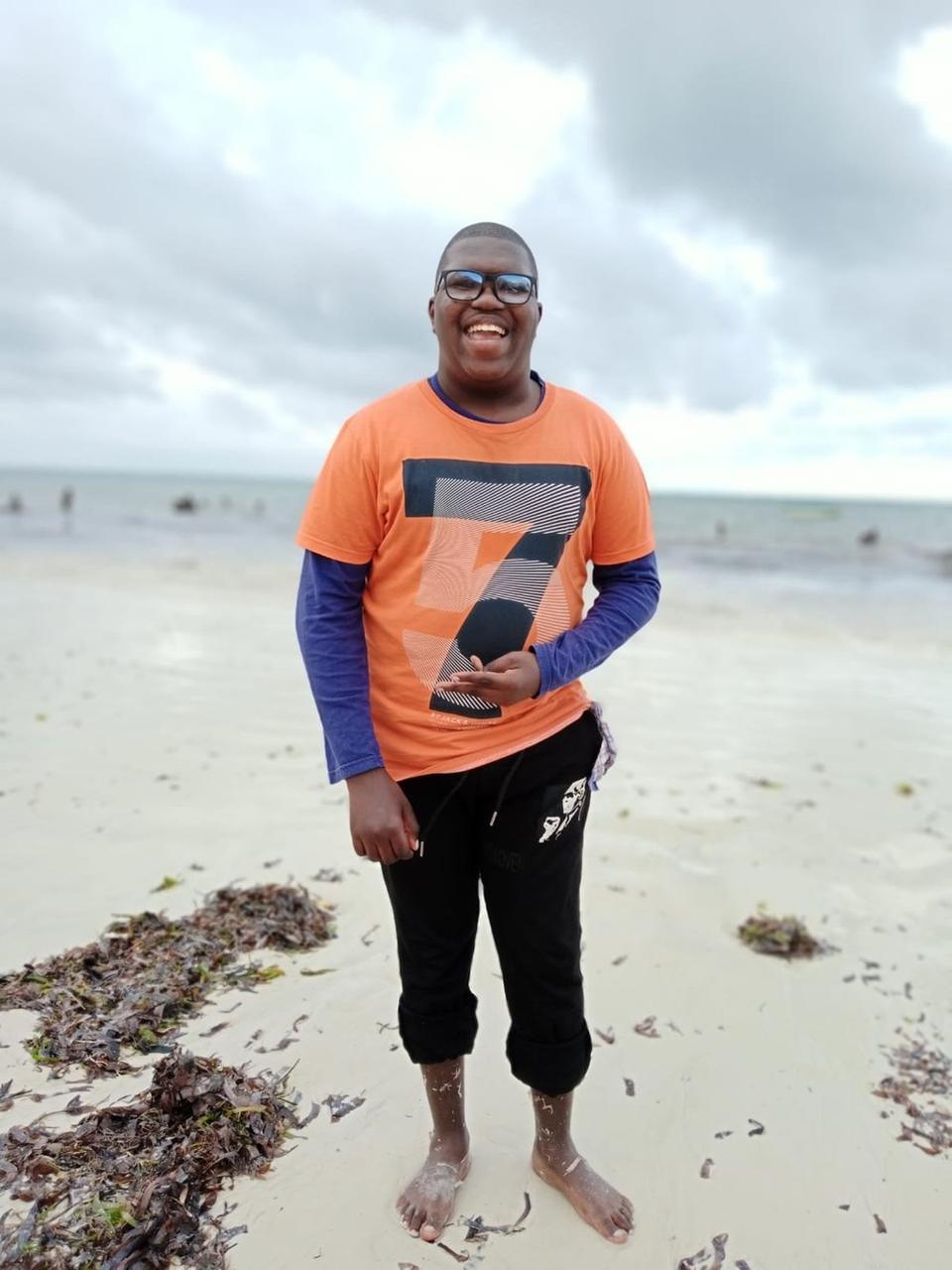 Alvin smiling at the beach