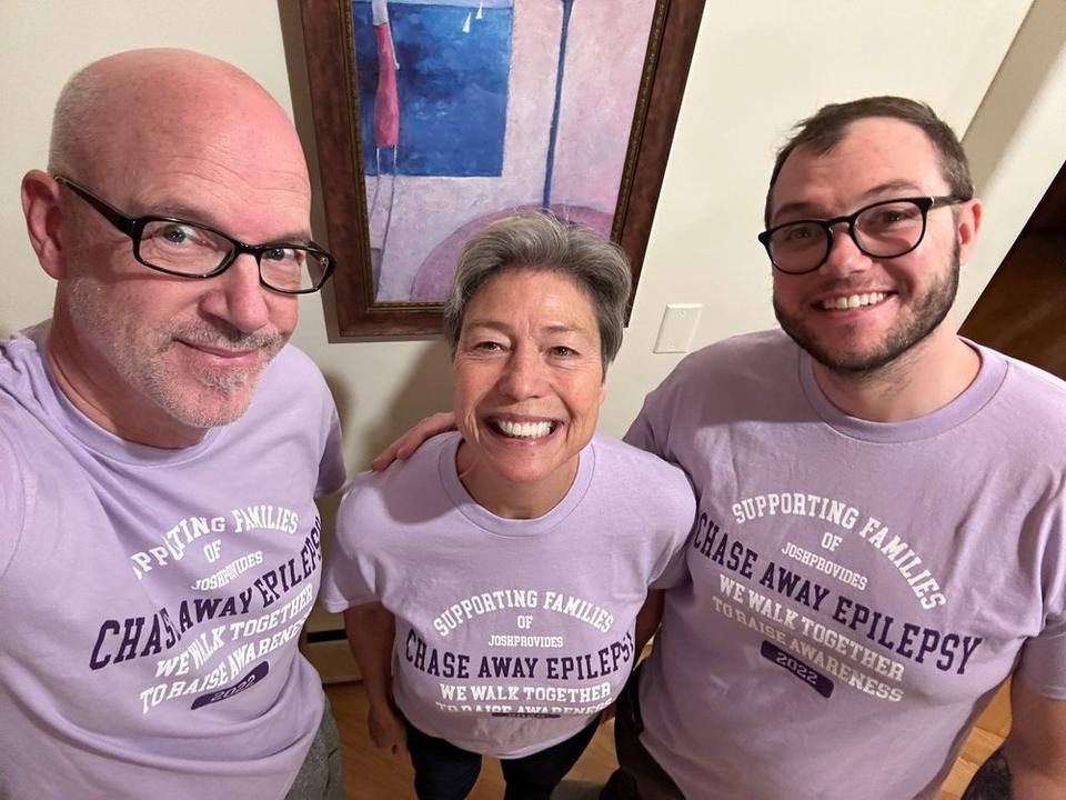The Anderson family wearing lavender shirts with the words, "Supporting families of JoshProvides; Chase Away Epilepsy; We walk together to raise awareness; 2022"