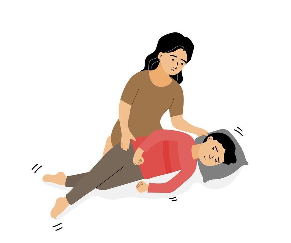A mother looking concerned and leaning towards her child who is experiencing a seizure episode.