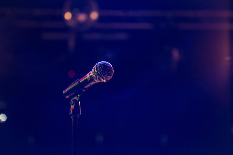 a microphone against a dark background
