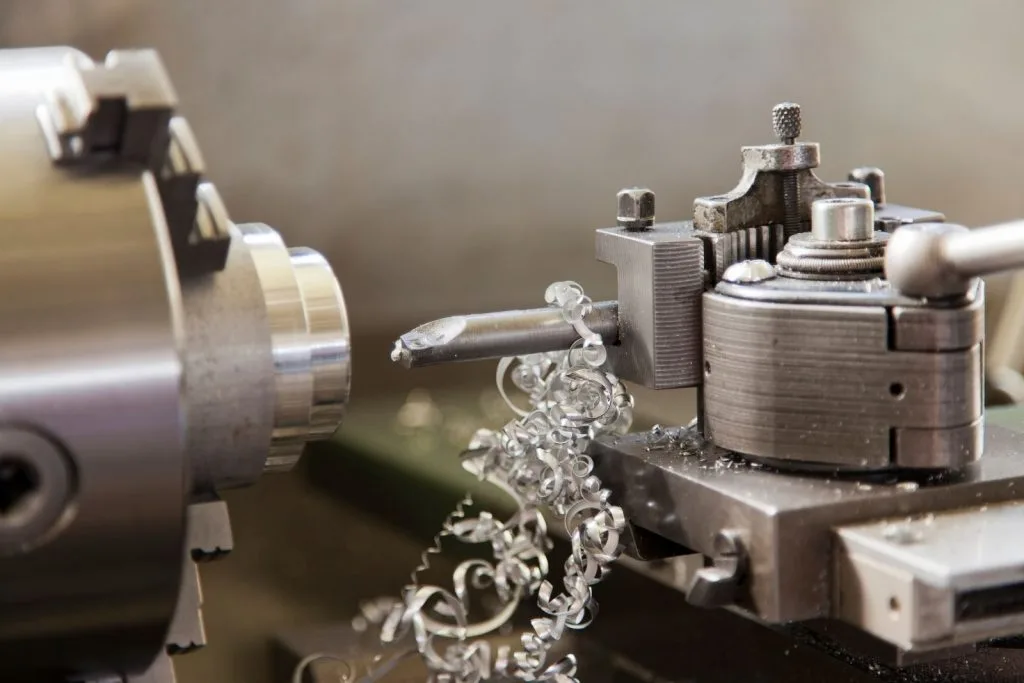 Lathe with steel chips hanging from the tool post
