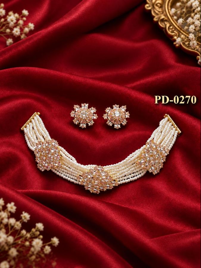 Elegant traditional jewelry set, which includes a multi-strand choker necklace and matching stud earrings.