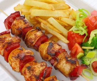 Chicken kabobs with fries