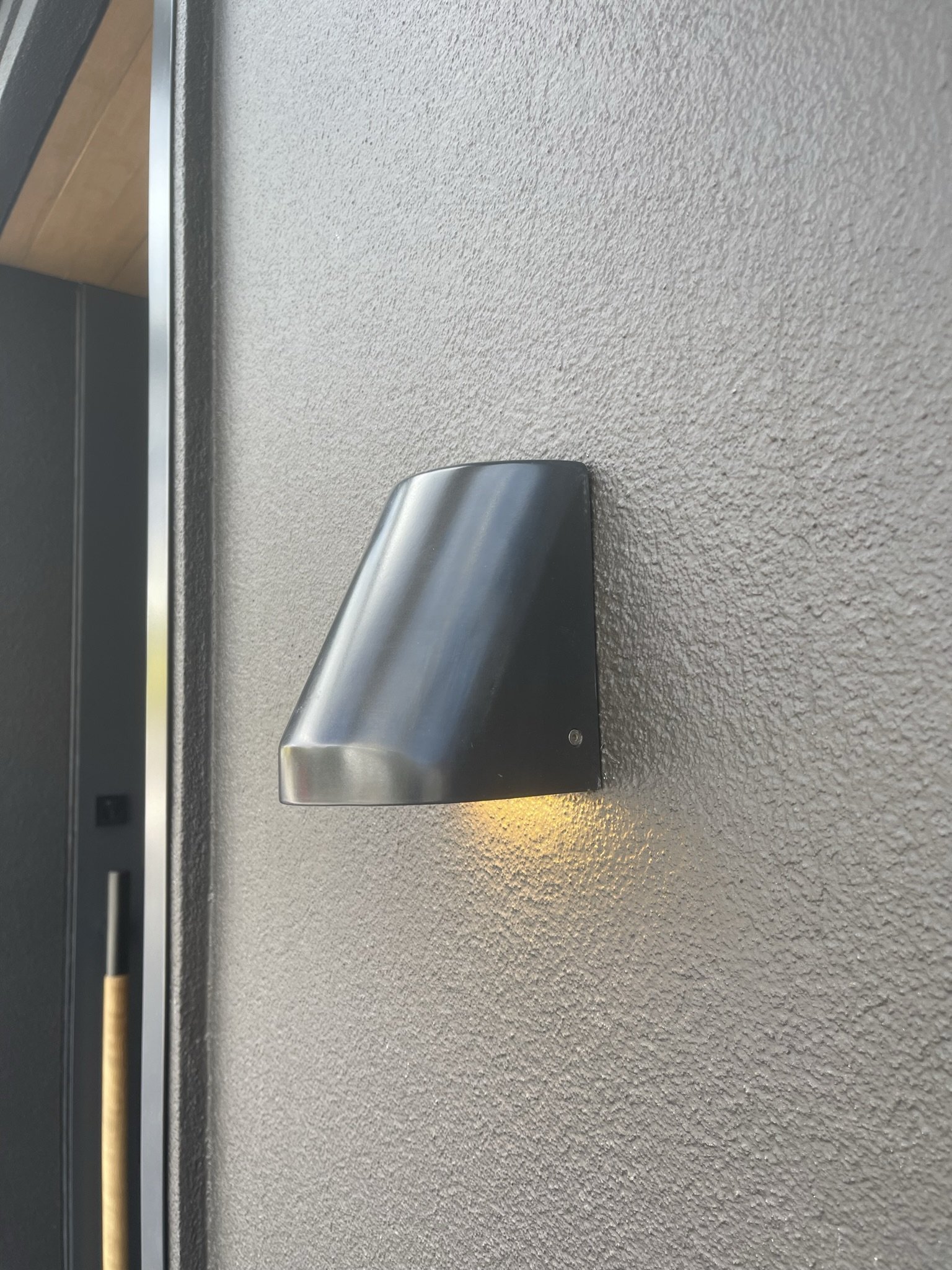 Blackened steel light with matt clear powdercoat