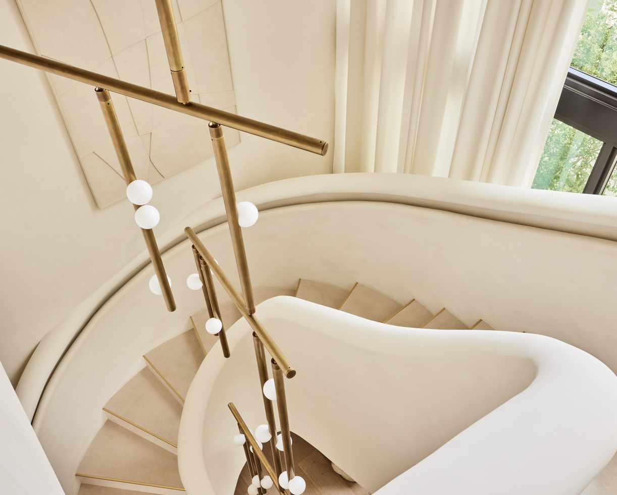 Lindsey Adelman Drop System chandelier over a staircase