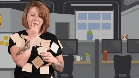 An office worker is crying and eating sticky notes that hold her to-do list.