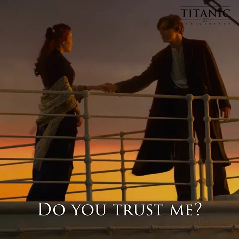 Jack and Rose from Titanic on the ship's deck. Jack holds Rose's hand and asks her, 