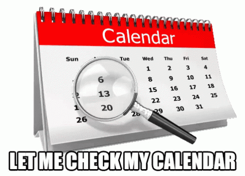 A magnifying glass hovering over a calendar