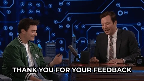 Jimmy Fallon saying, ''thank you for the feedback.'' Noah Schnapp is sitting on the left. 