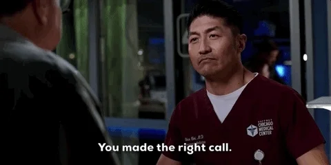 A man in hospital scrubs saying, 