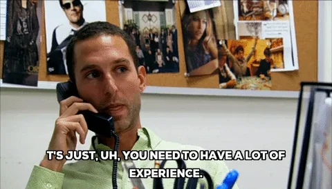 A man talking on the phone says, 