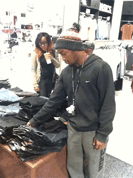  Man being shocked by the price of clothes