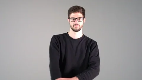 A teacher rolls up his sleeves to get ready.
