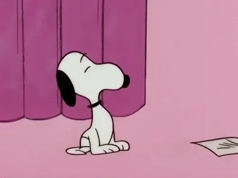 Snoopy making a disgusted face by closing his eyes and sticking out his tongue.