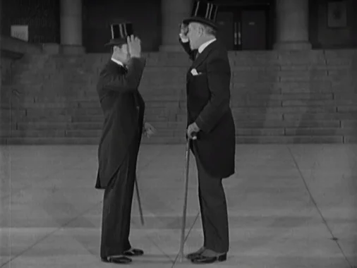 Two gentlemen greeting each other by tipping their top hats.