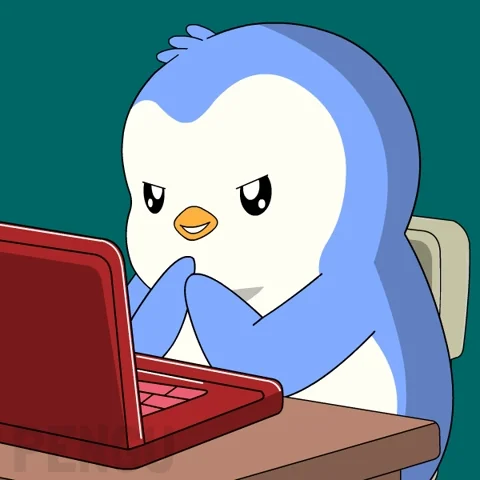 A penguin in front of the laptop.