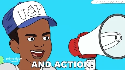 A cartoon figure of black boy with megaphone. The caption reads: And action! 